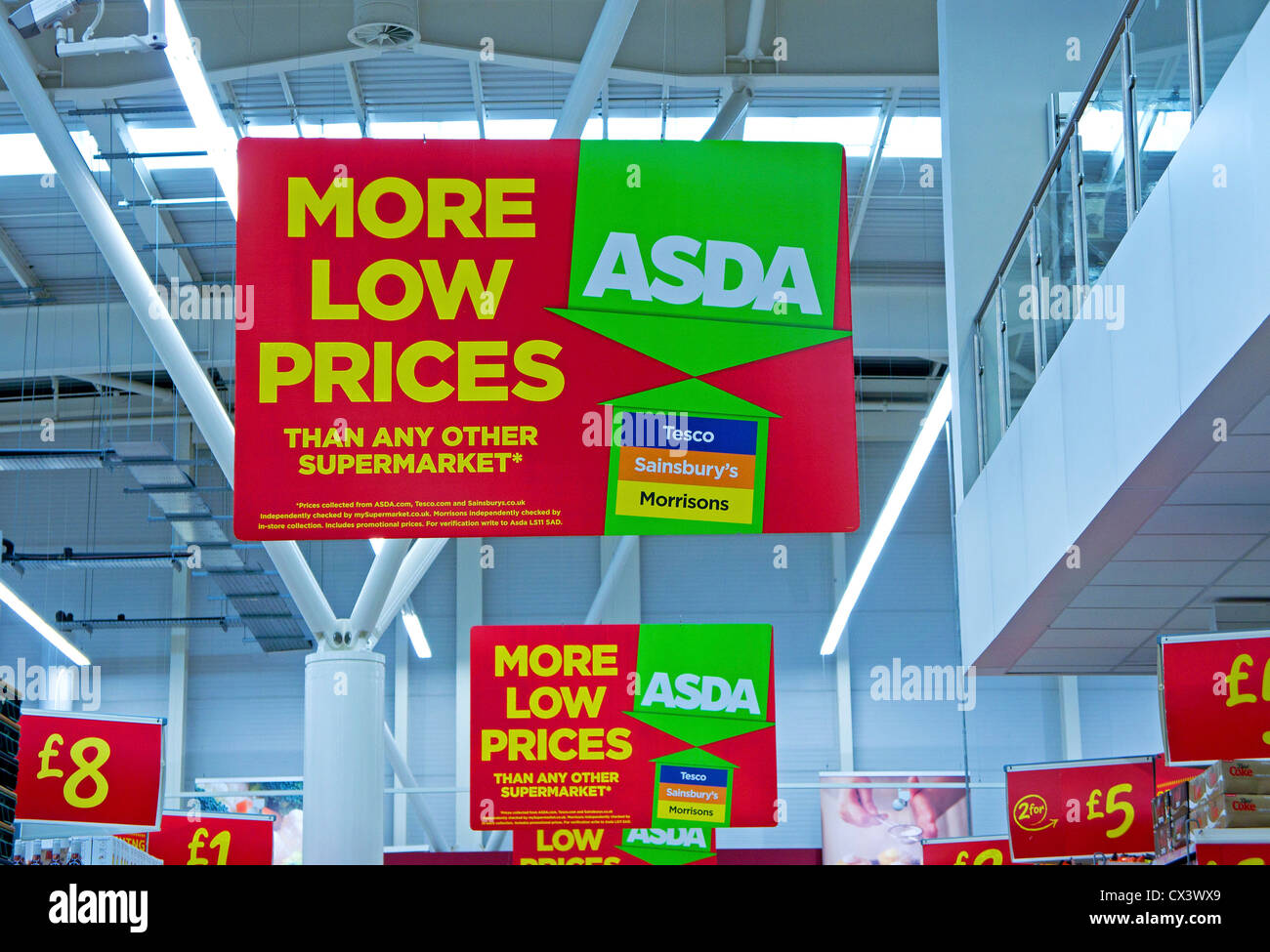 Low price advertising signs in an Asda store, UK Stock Photo