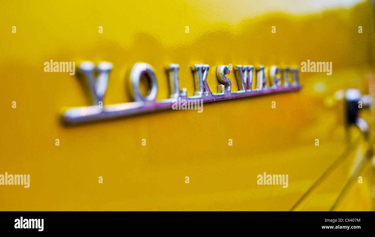 Macro of the Volkswagen badge on a bright yellow VW camper at the Dunstable Dubbers meet. Stock Photo