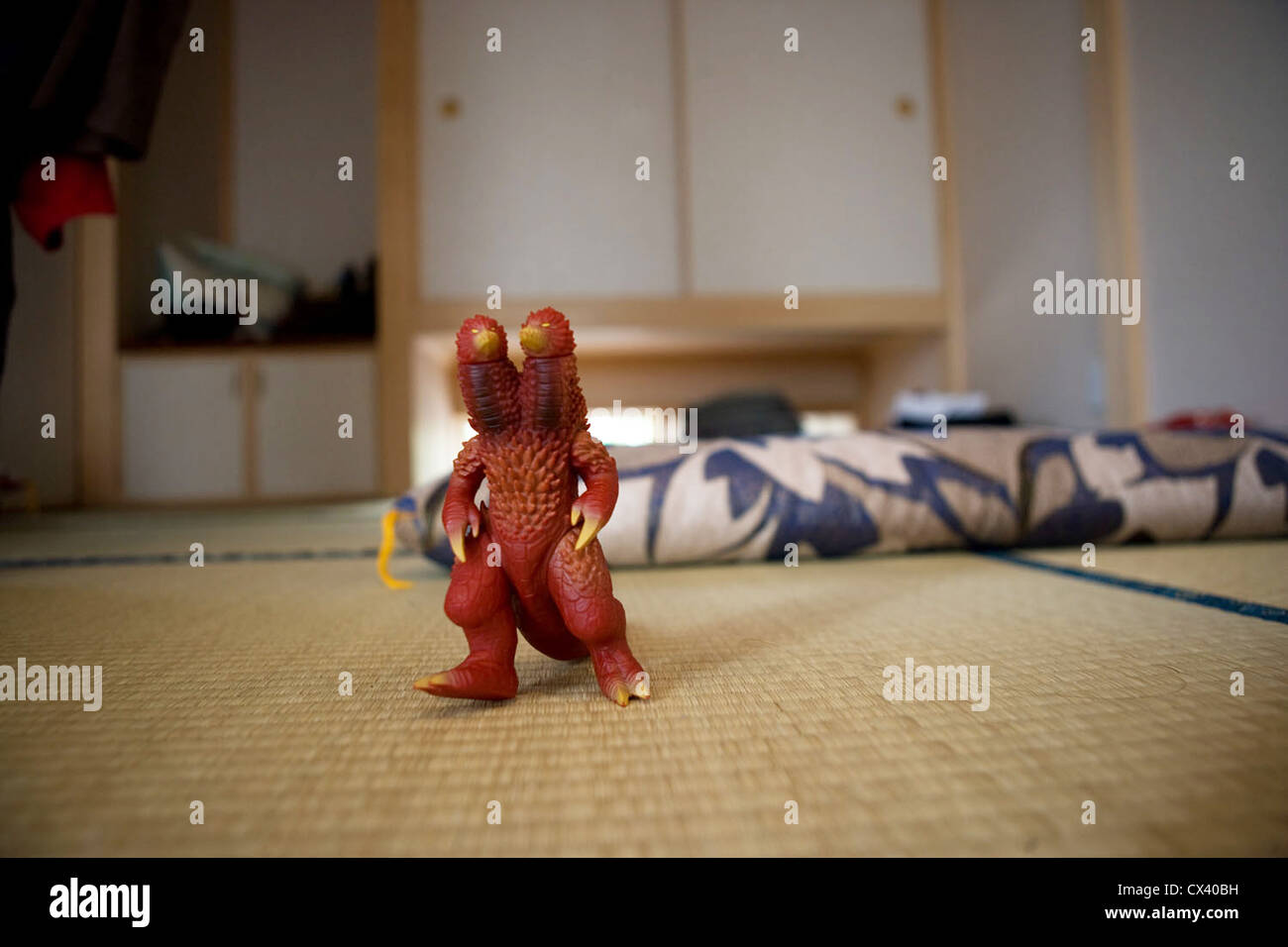 Japanese Kaiju monster action figure on a tatami floor in Japan. Stock Photo