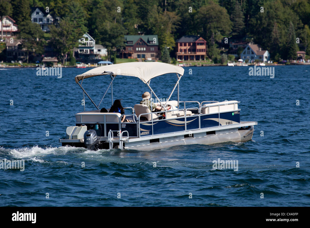 Pontoon deck boat on United States America Adirondack State Park Lake