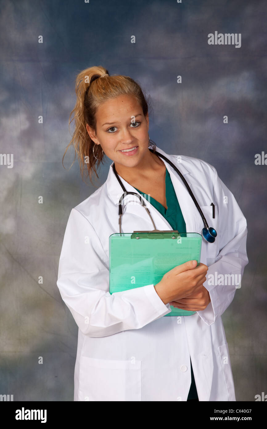 Female health care worker, wearing a white lab coat, and stethoscope