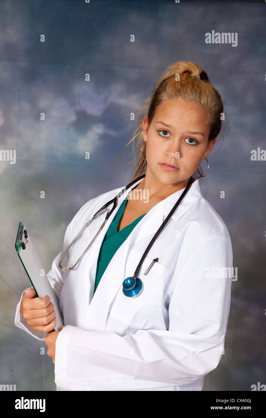 Female health care worker, wearing a white lab coat, and stethoscope