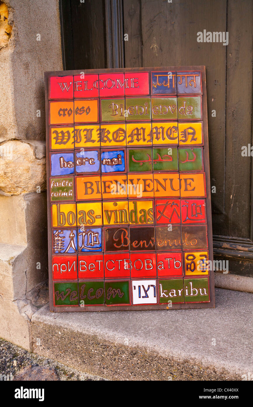 colourful multi lingual welcome sign Oamaru Victorian Precinct Stock Photo