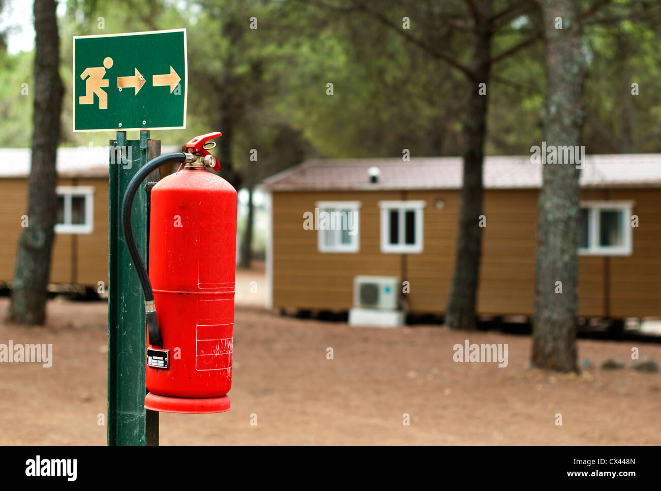 Red fire extinguisher and mobile homes. Fire safety Stock Photo Alamy