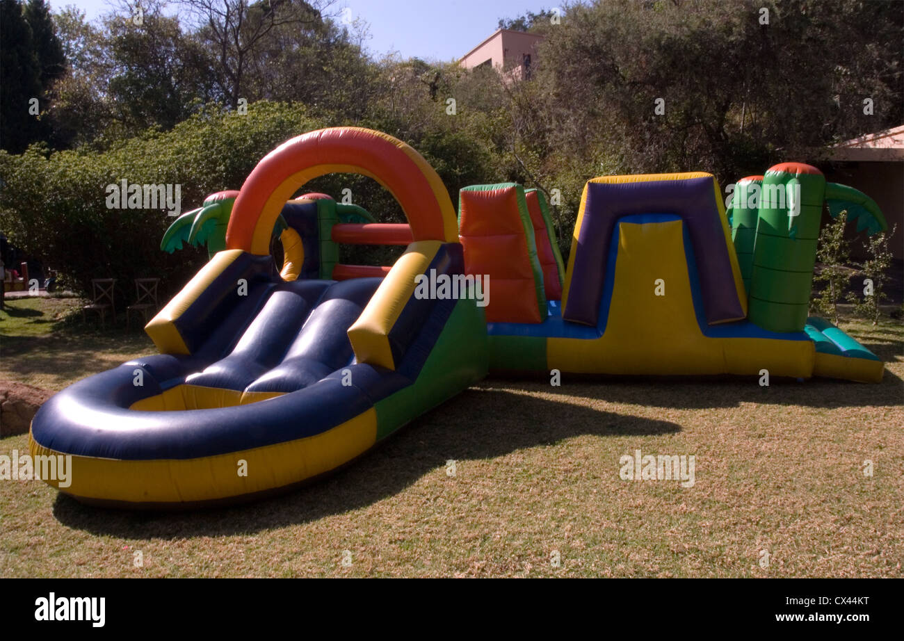 Jumping castle for kids party with slide entertainment Stock Photo Alamy