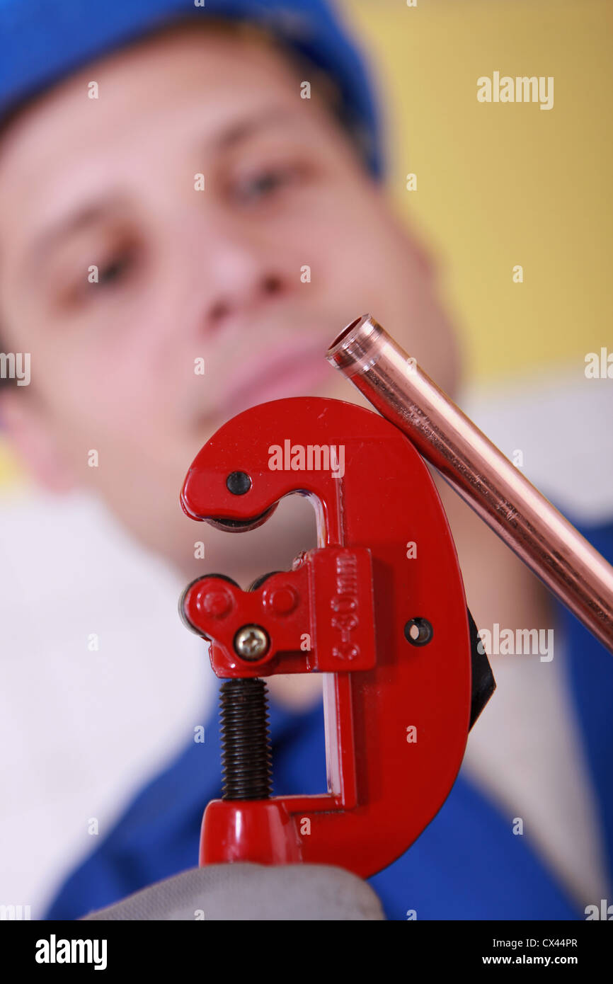 Plumber cutting copper pipe Stock Photo Alamy