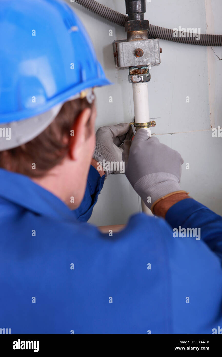 Close up of a plumber fixing some internal water pipes Stock Photo Alamy