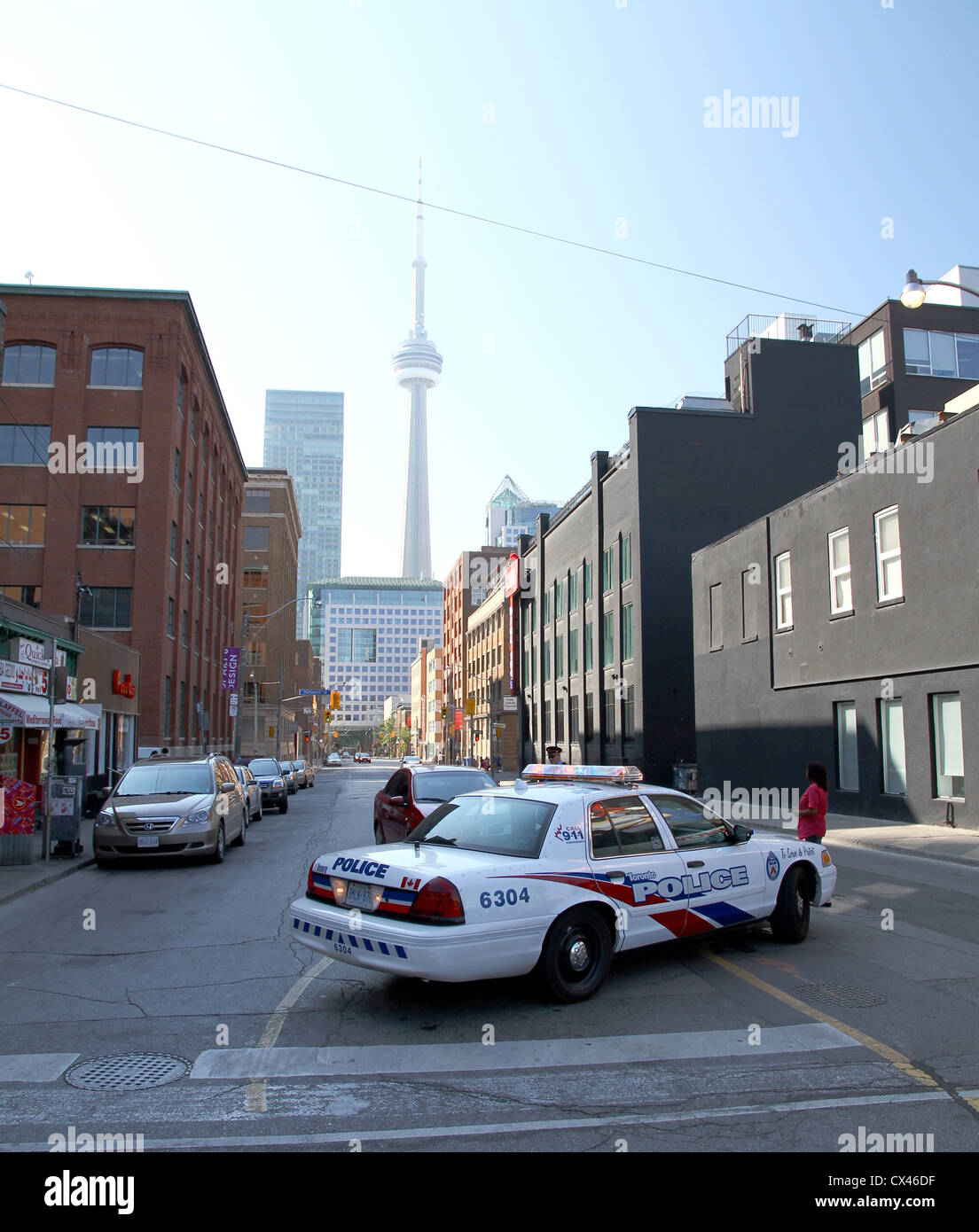 A Toronto Police car and agent in a Toronto Downtown street Stock Photo