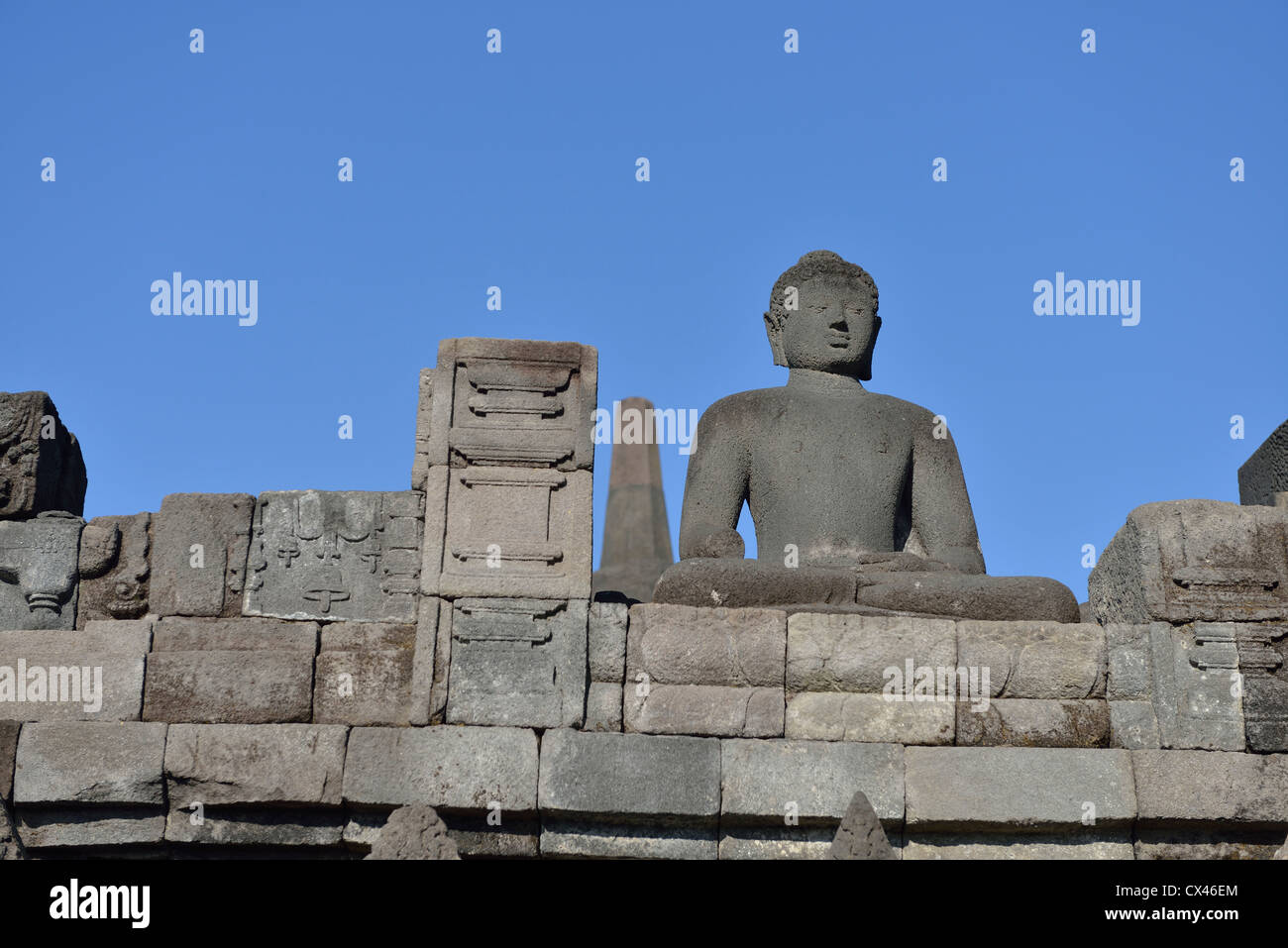 One of the statues of Buddha at the temple of Borobudur; Central Java, Indonesia. Stock Photo