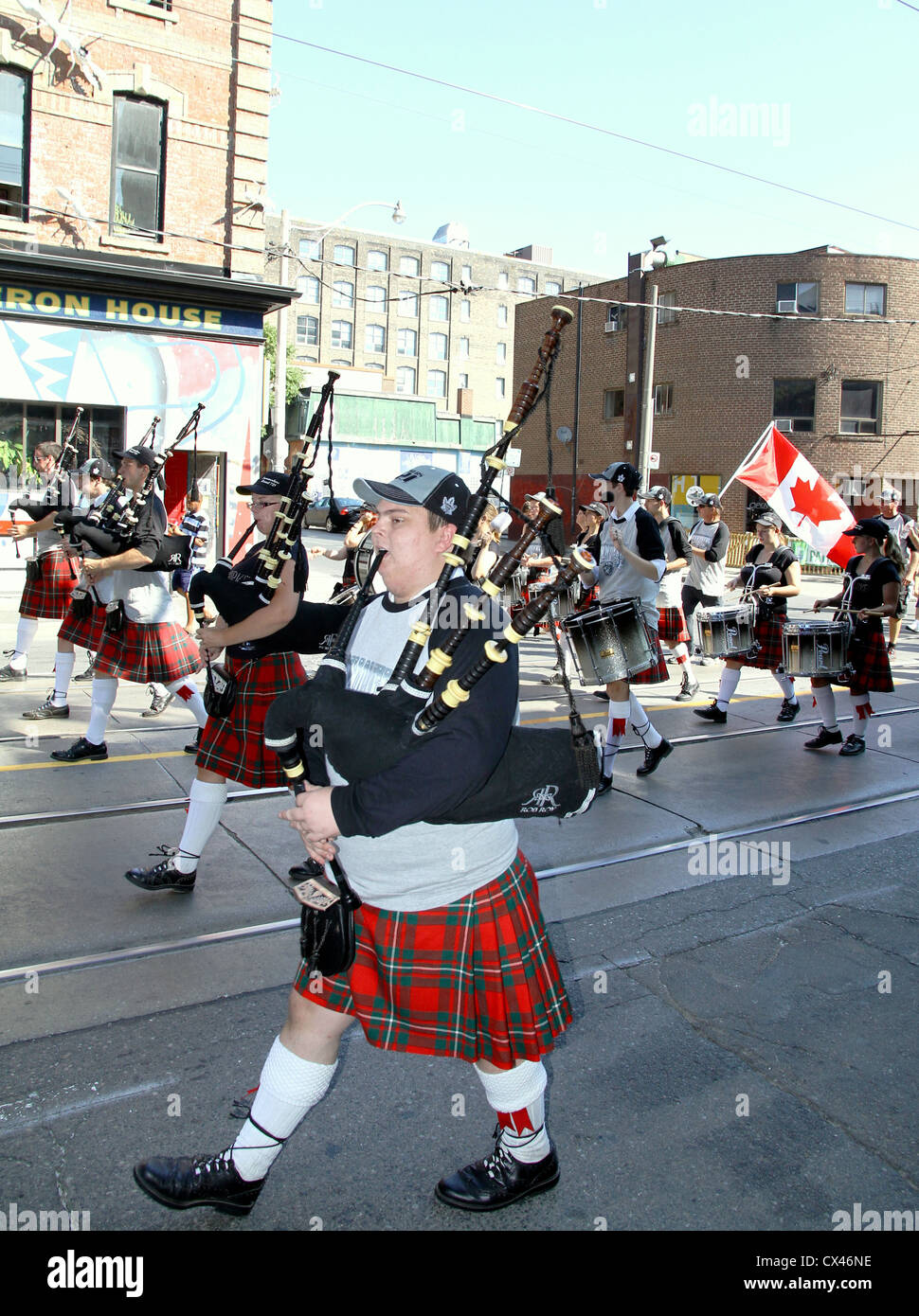 Bagpipe band and highland dancers marching at the annual Labor Day