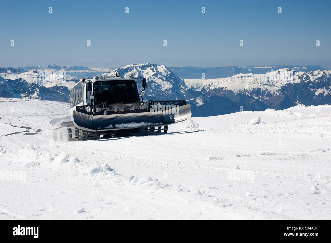 Snow groomer in the French Alps Stock Photo