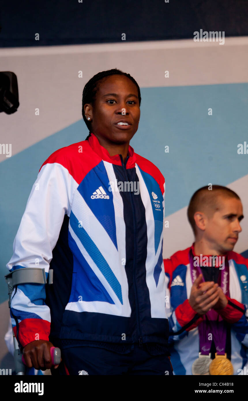 Ifeoma Dieke, Football Olympian: homecoming for Scottish Olympians & Paralympians. Neil Fachie, paralympic cyclist in background Stock Photo