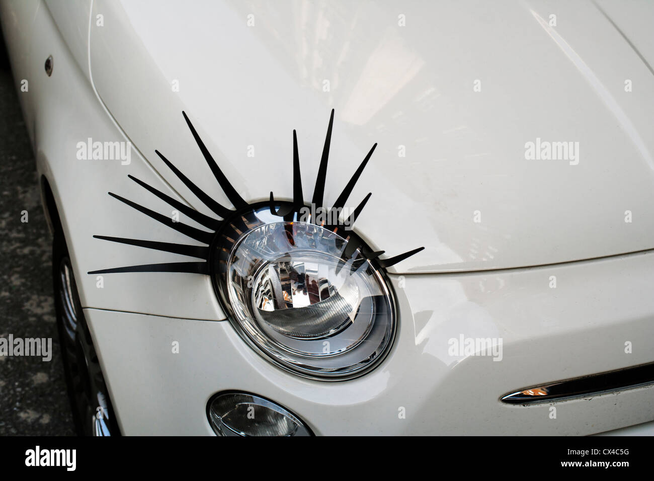 Cute Eye-lashes accessories on Fiat Cinquecento, Melcome Street, London, England, UK Stock Photo