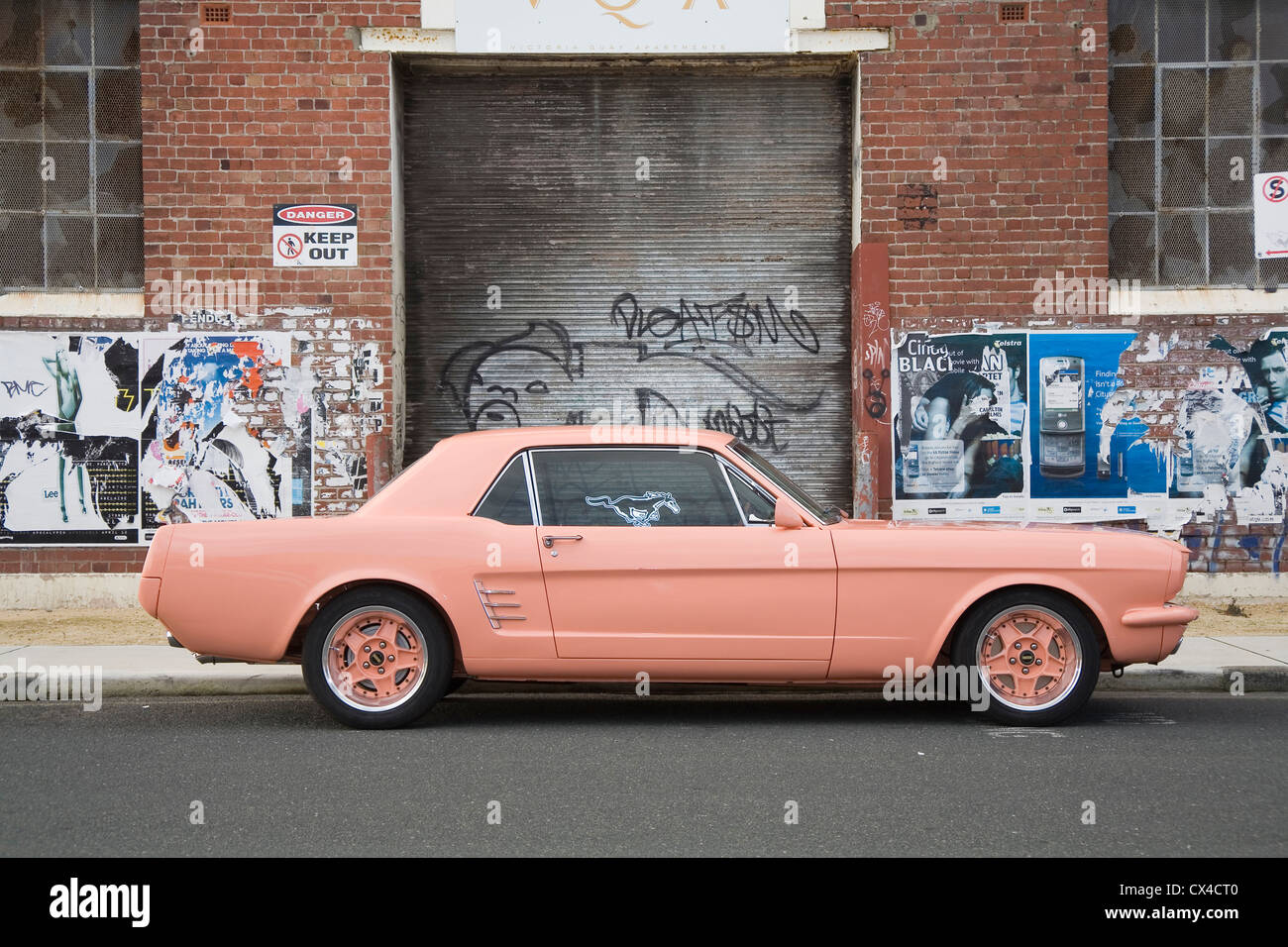 Modified and customized pink Ford Mustang. Stock Photo