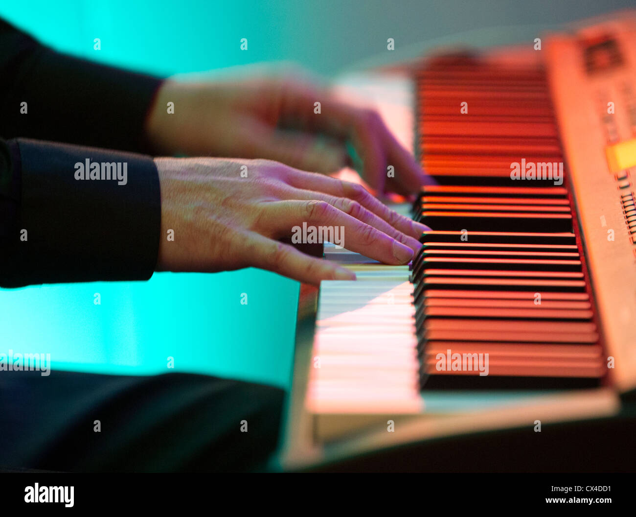 Close-up of a pianist's hands (in this case a jazz pianist) playing electric piano . keyboard. Stock Photo