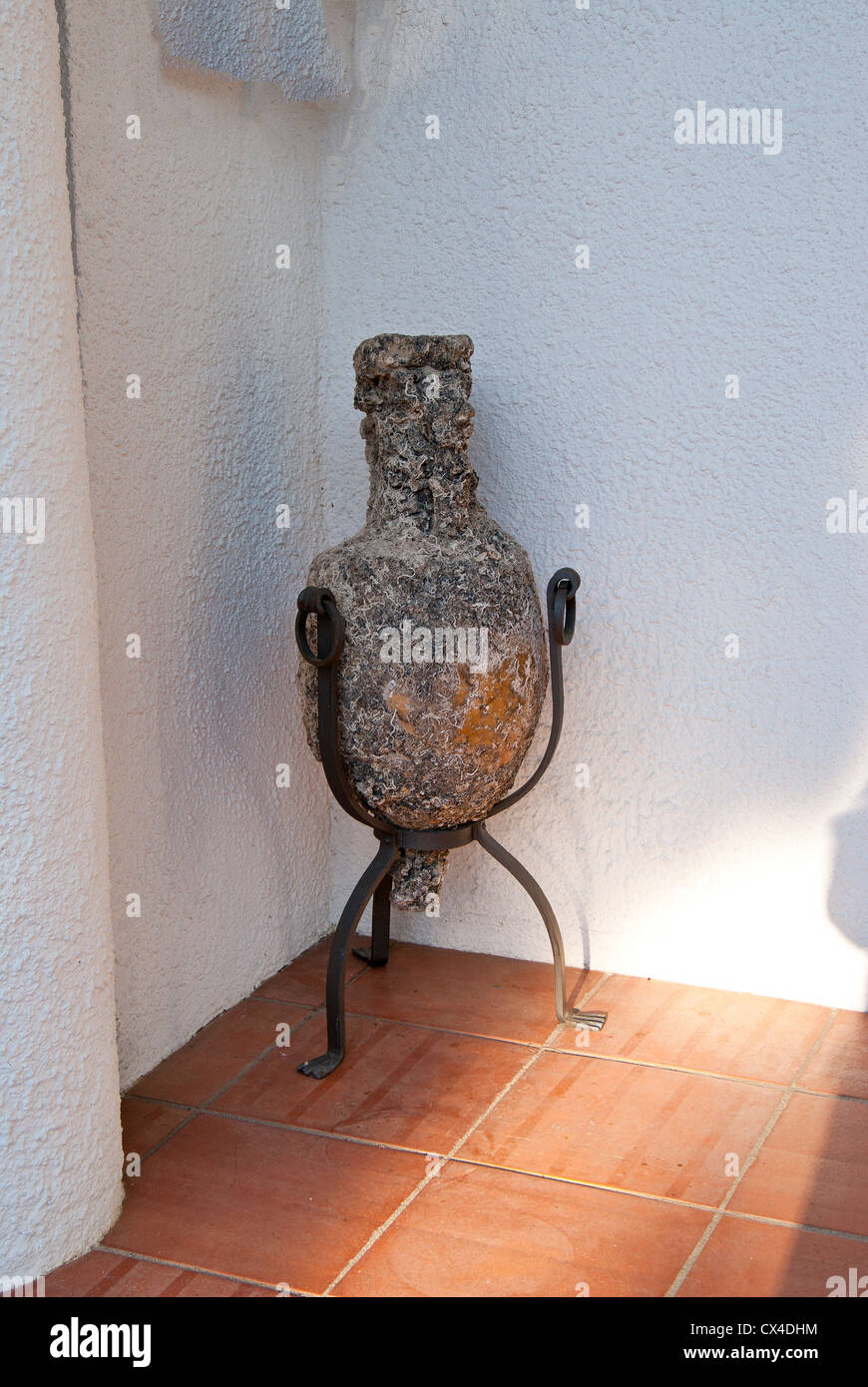 Ancient amphora plastered with seashell from the sunken ship Stock Photo