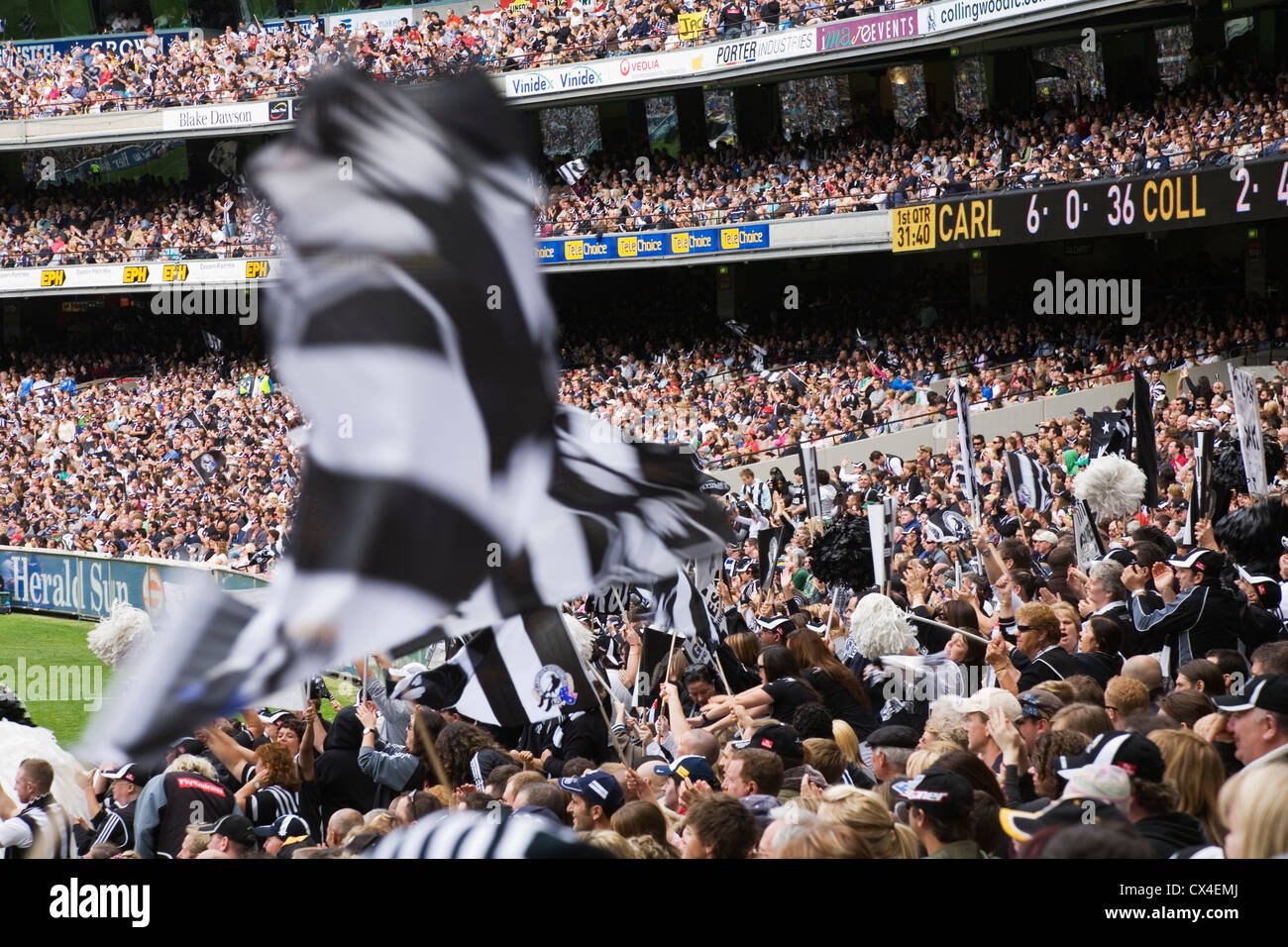 Supporters cheer on their teams at an Australian Rules football game at the MCG.  Melbourne, Victoria, AUSTRALIA Stock Photo
