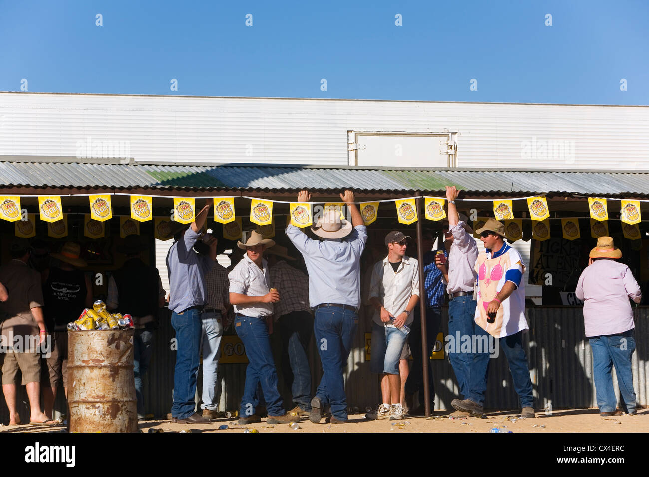 Bush locals drink at the bar during the Birdsville Races.  Birdsville, Queensland, AUSTRALIA Stock Photo
