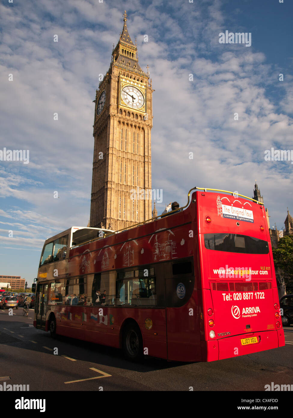 Tour bus approaching Big Ben clock tower, Palace of Westminster (Houses of Parliament), City of Westminster, London, England, UK Stock Photo