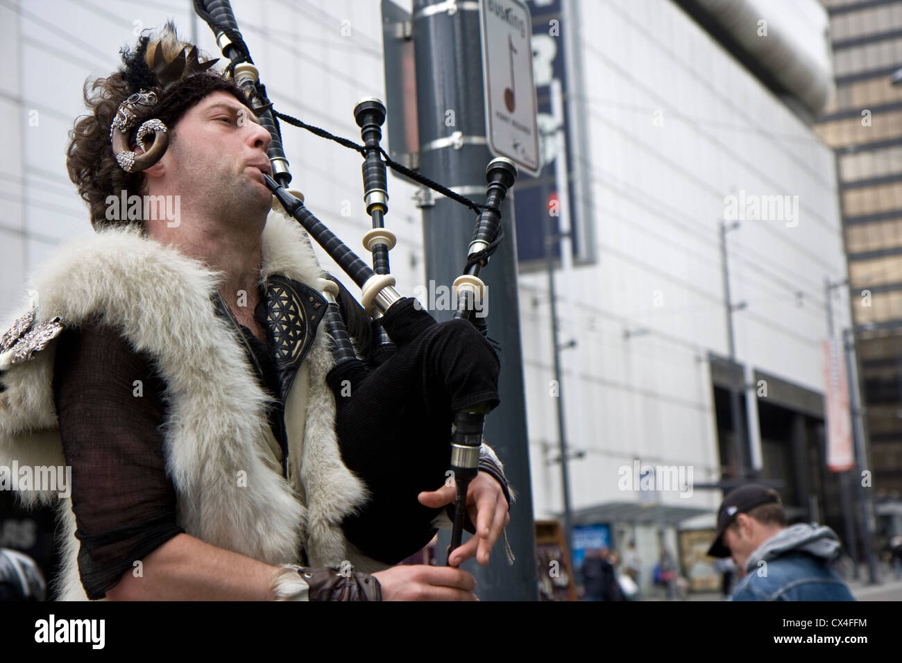 Street musician in Vancouver city center playing a bagpipe Stock Photo