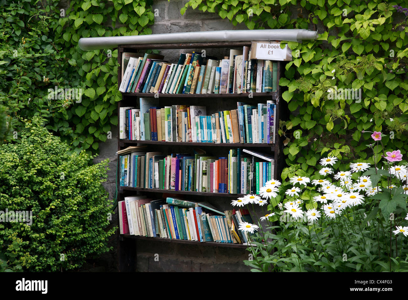 Outdoor bookshelf and honesty box, Hay on Wye, Powys, Wales, UK Stock Photo