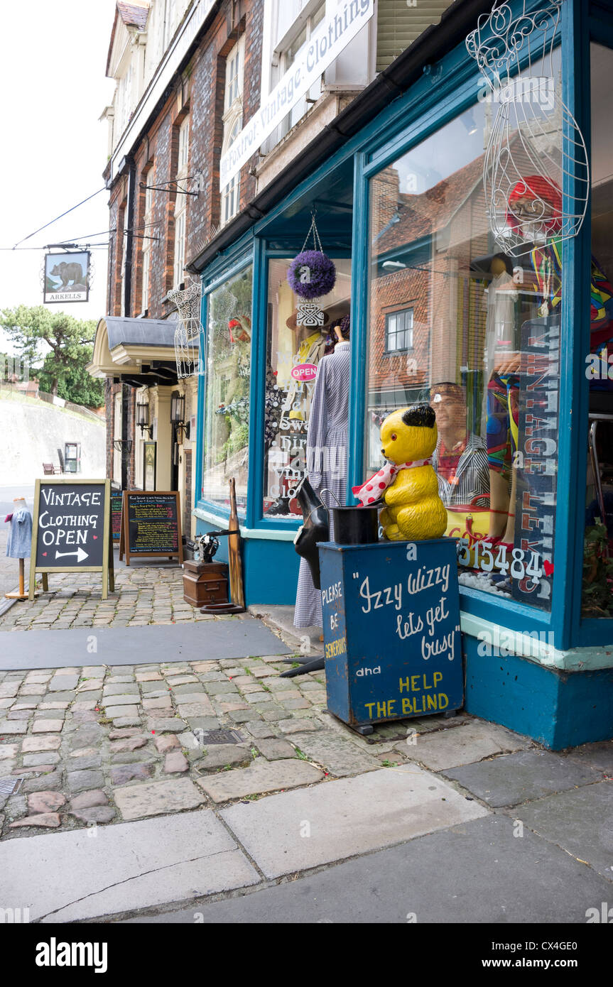 Old fashioned Sooty the Bear charity money box outside of a shop