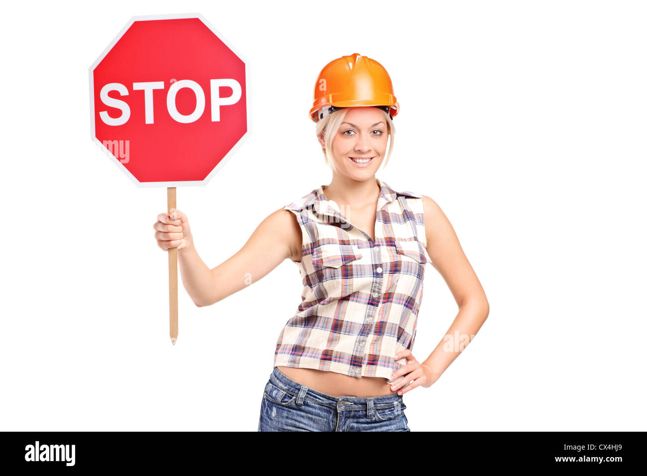 A construction worker holding a traffic sign stop isolated on white