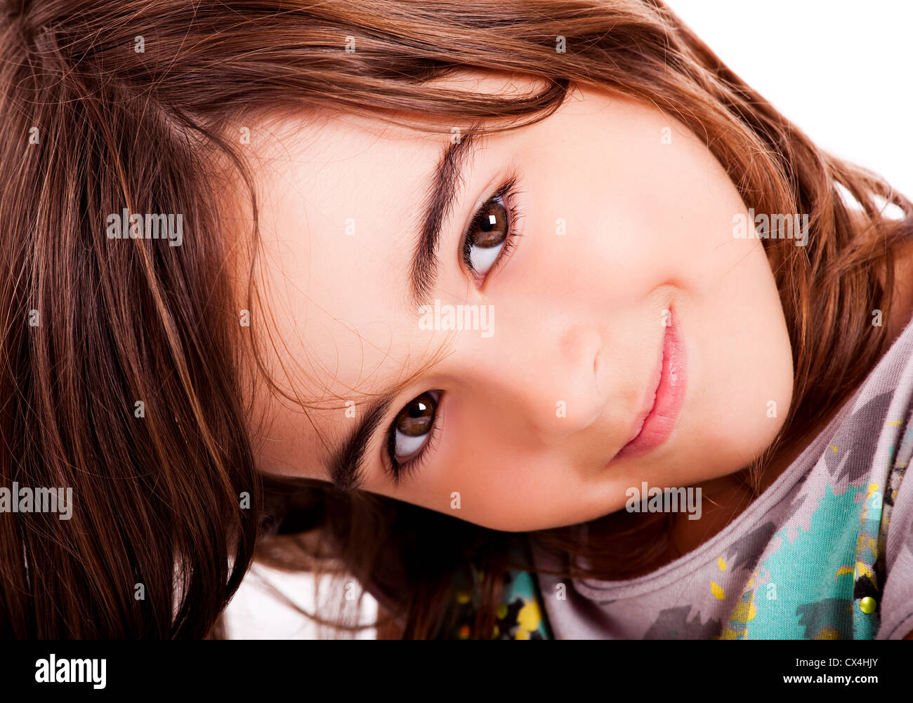 Close-up portrait of a little girl looking at the camera Stock Photo ...