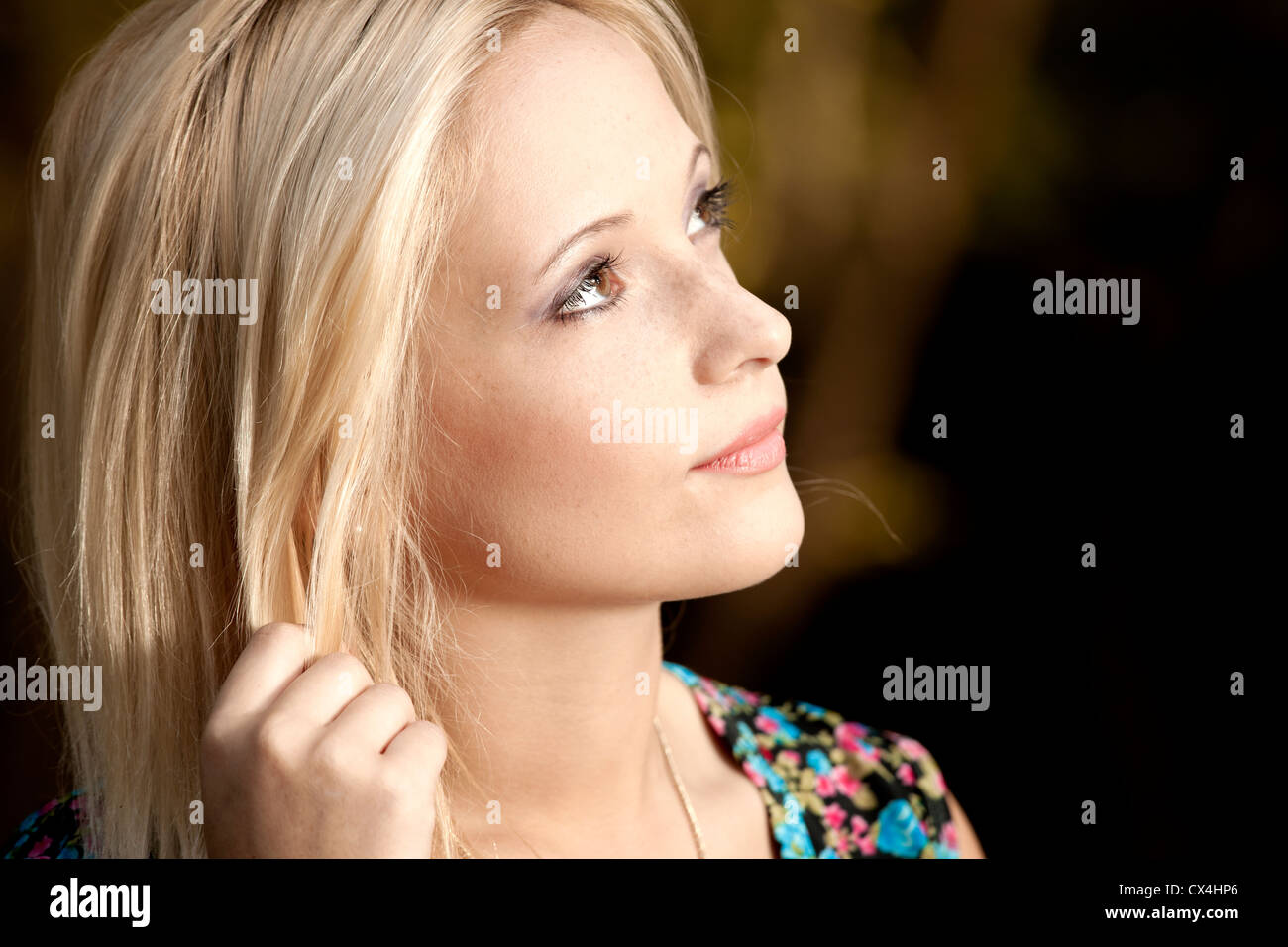 Outdoor portrait of a beautiful young woman in the park Stock Photo - Alamy