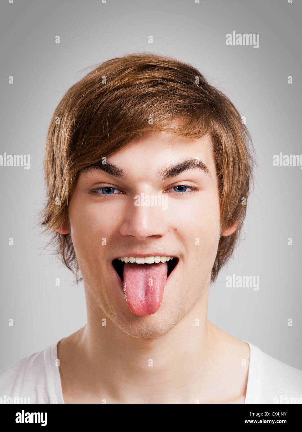 Portrait of a handsome young man, over a gray background Stock Photo ...