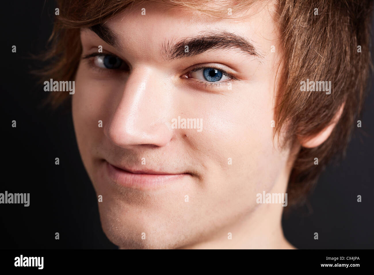 Close-up portrait of a happy young man looking into the camera Stock ...