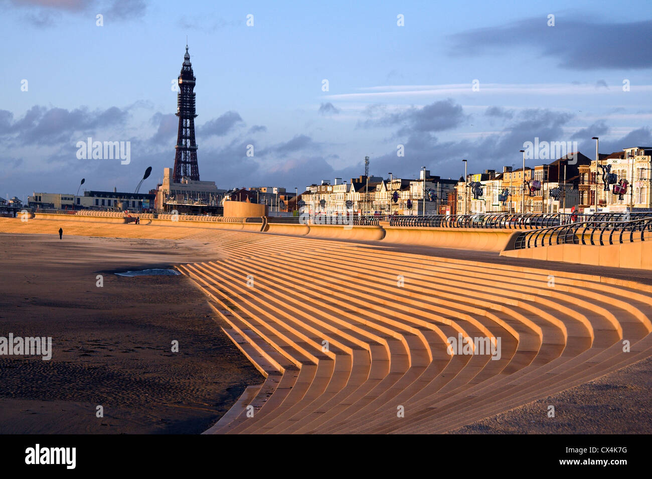 Steps onto the beach, regenerated Blackpool Promenade, with Blackpool Tower in the distance, Lancashire, UK Stock Photo
