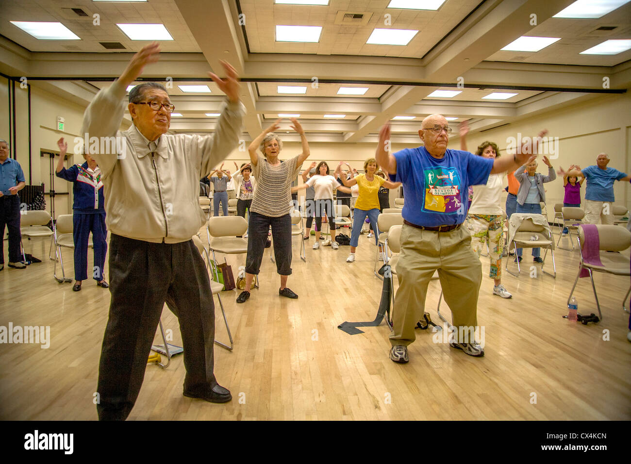 Senior women and men work out during an exercise class at a senior center in Tustin, CA. Stock Photo