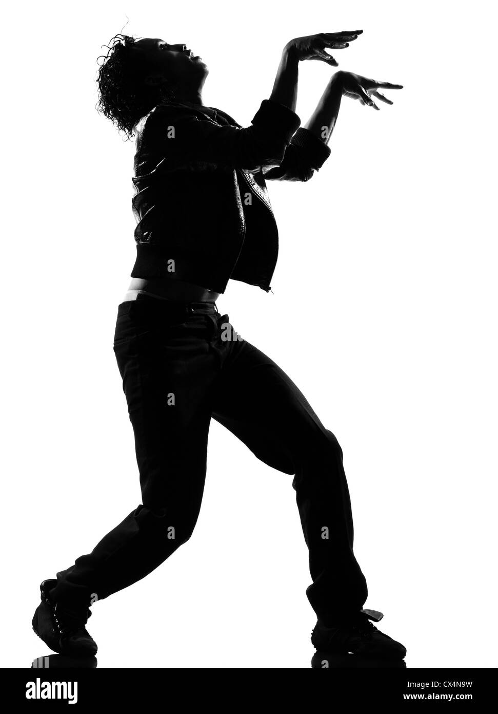 full length silhouette of a young man dancer dancing funky hip hop r&b zombie walk on  isolated  studio white background Stock Photo