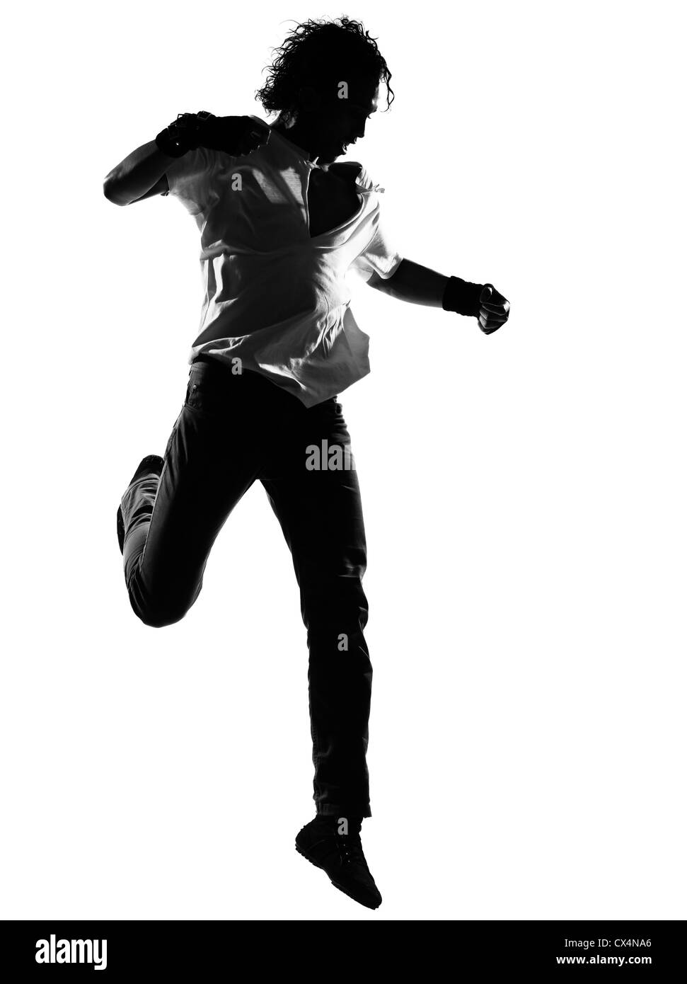 full length silhouette of a young man dancer dancing funky hip hop r&b on  isolated  studio white background Stock Photo