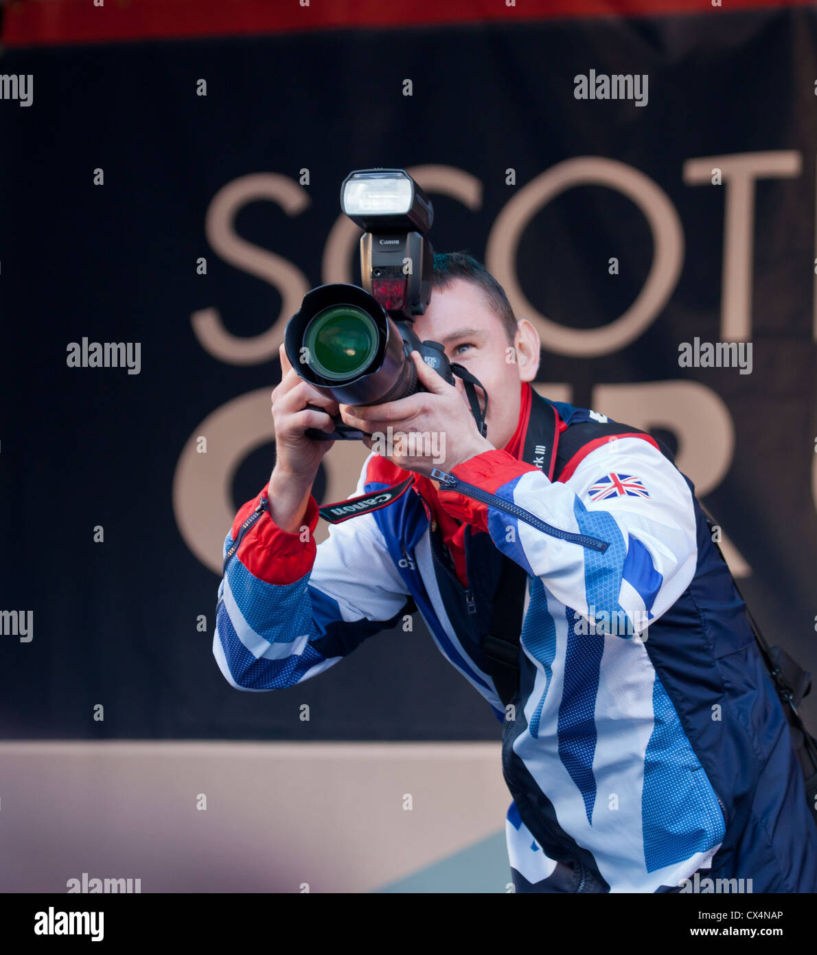 Craig Connell 5-a-side Football player photographs the crowd in George Square homecoming for Scottish Olympians and Parlaympians Stock Photo