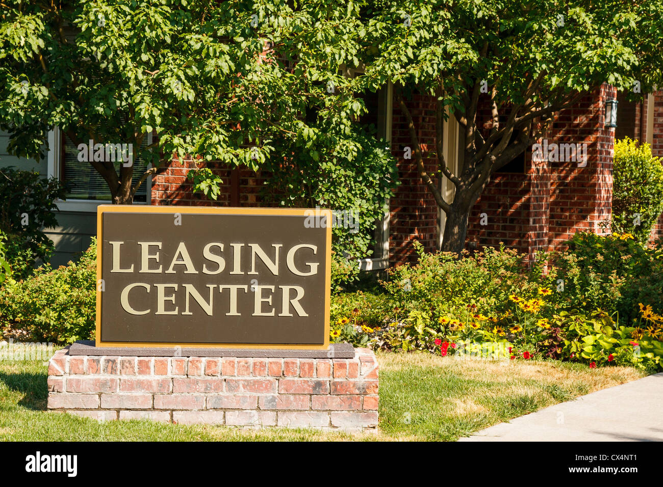 Leasing Center sign at a landscaped apartment complex Stock Photo