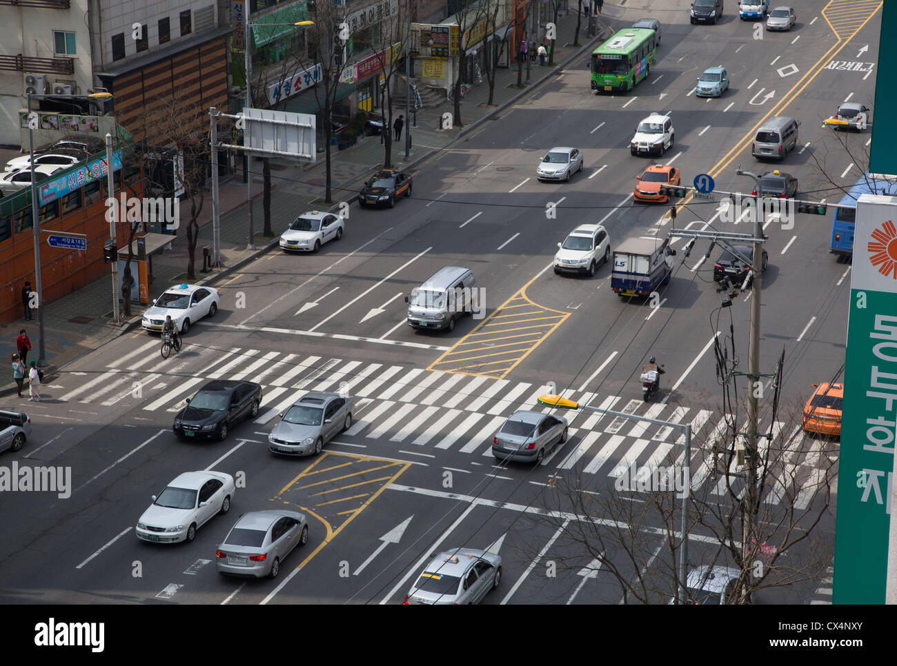 A typical street scene at a pedestrian crosswalk on a busy street in Seoul, South Korea Stock Photo