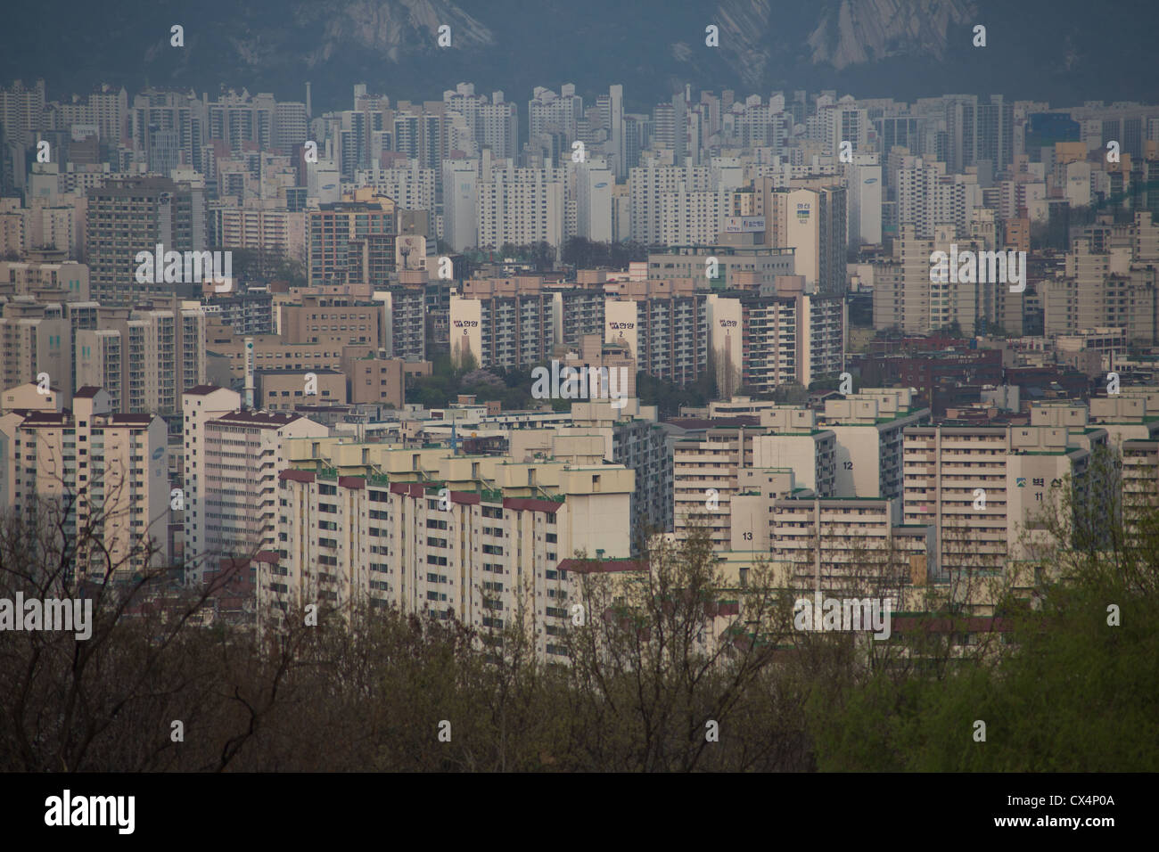Hundreds of high rise apartment buildings crowded together near the mountains in Seoul, South Korea Stock Photo