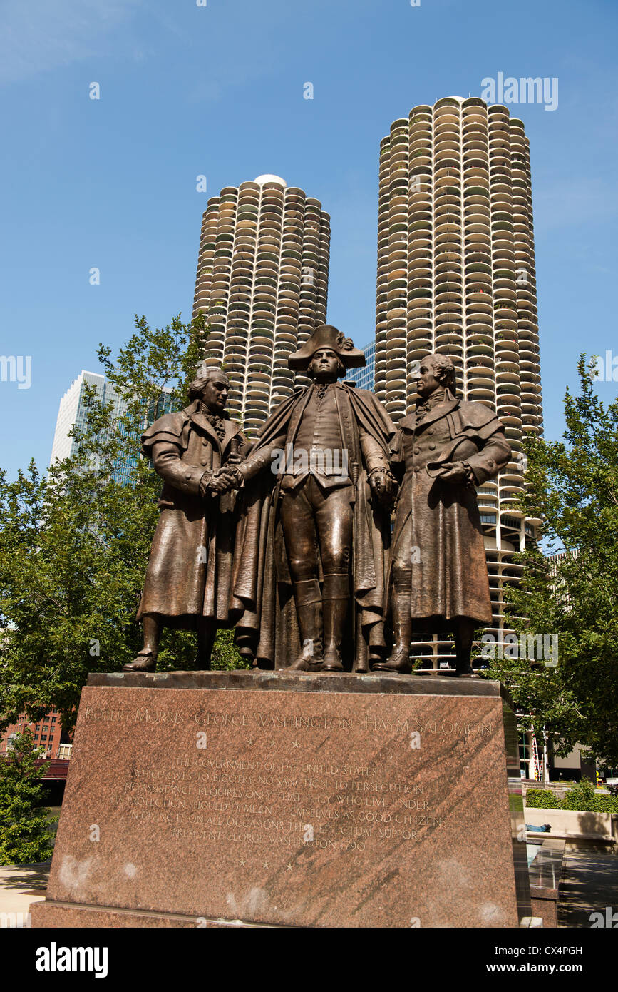 Statue of Robert Morris, George Washington and Hyam Salomon (l to r) on the banks of the Chicago River with Marina City beyond. Stock Photo