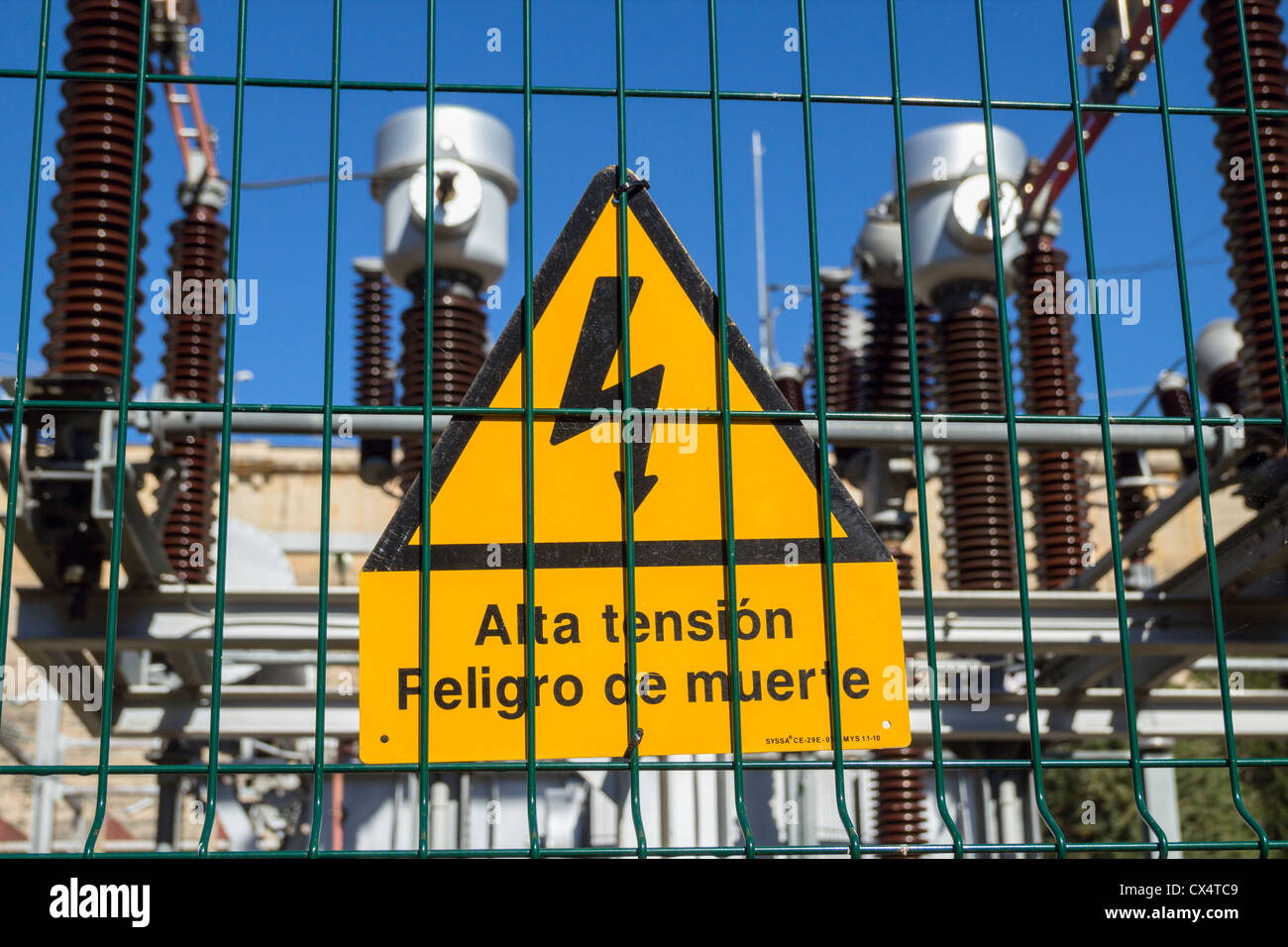 Alta tension peligro de muerto (high tension danger of death) sign on hydro electric power station in Spain Stock Photo