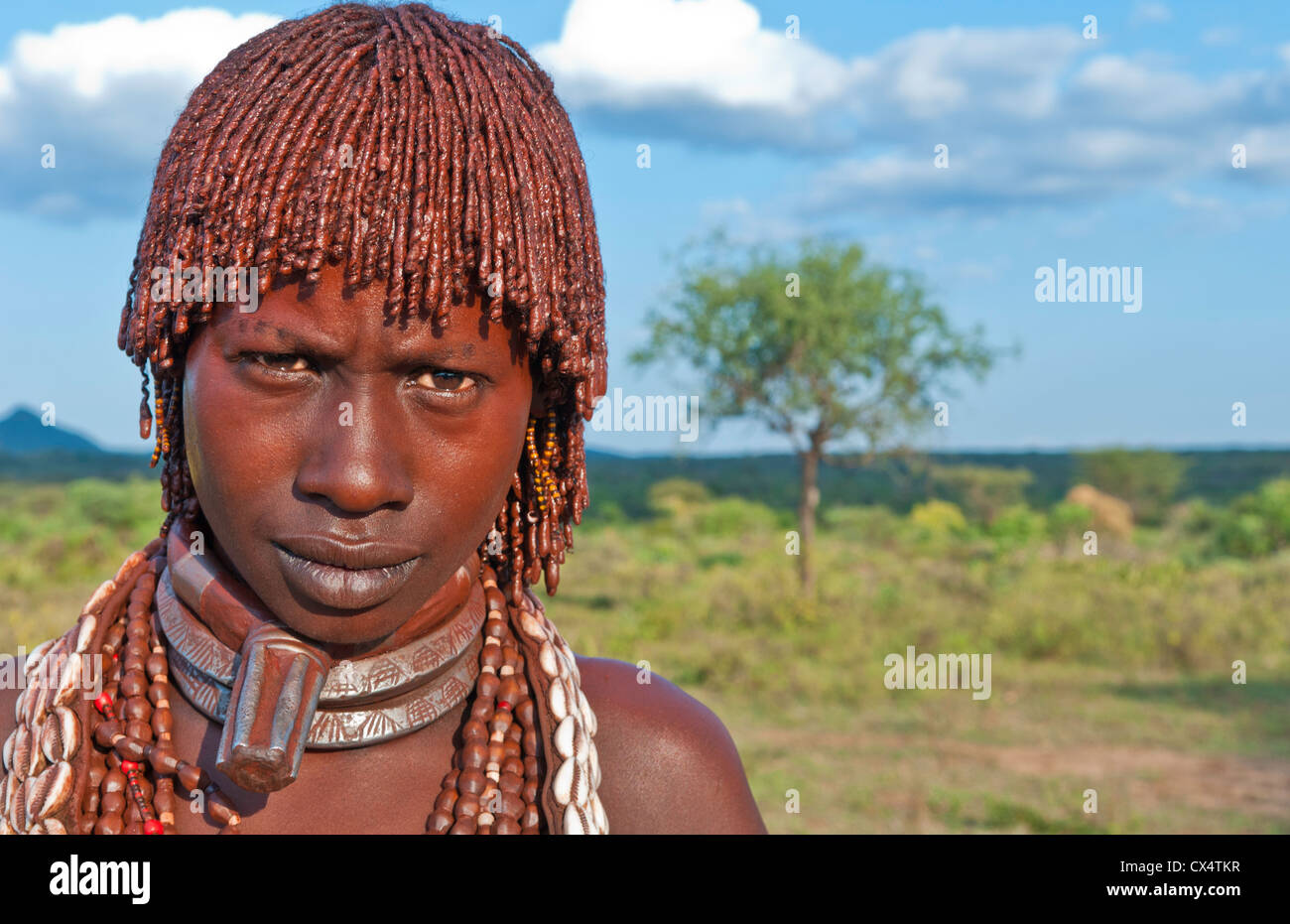 Turmi Ethiopia Africa village Lower Omo Valley Hamar Hammer tribe portrait of woman in village at sunset #24 Stock Photo