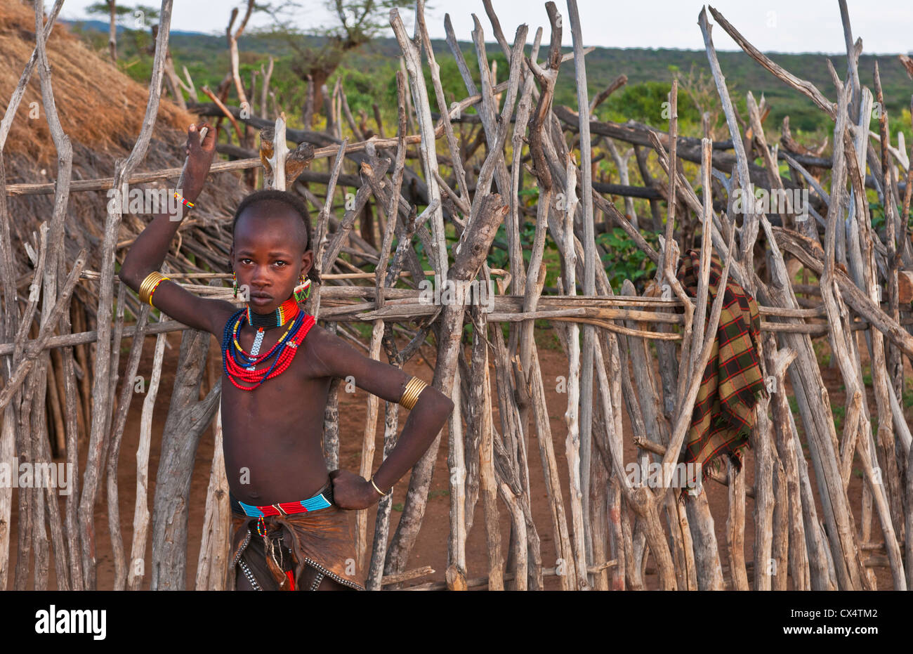 Turmi Ethiopia Africa village Lower Omo Valley Hamar Hammer tribe young  girl in village at fence Stock Photo - Alamy
