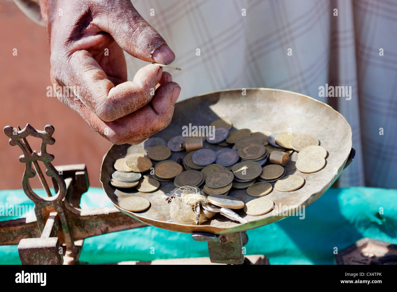 Moroccan dirham coins in a scale. Stock Photo