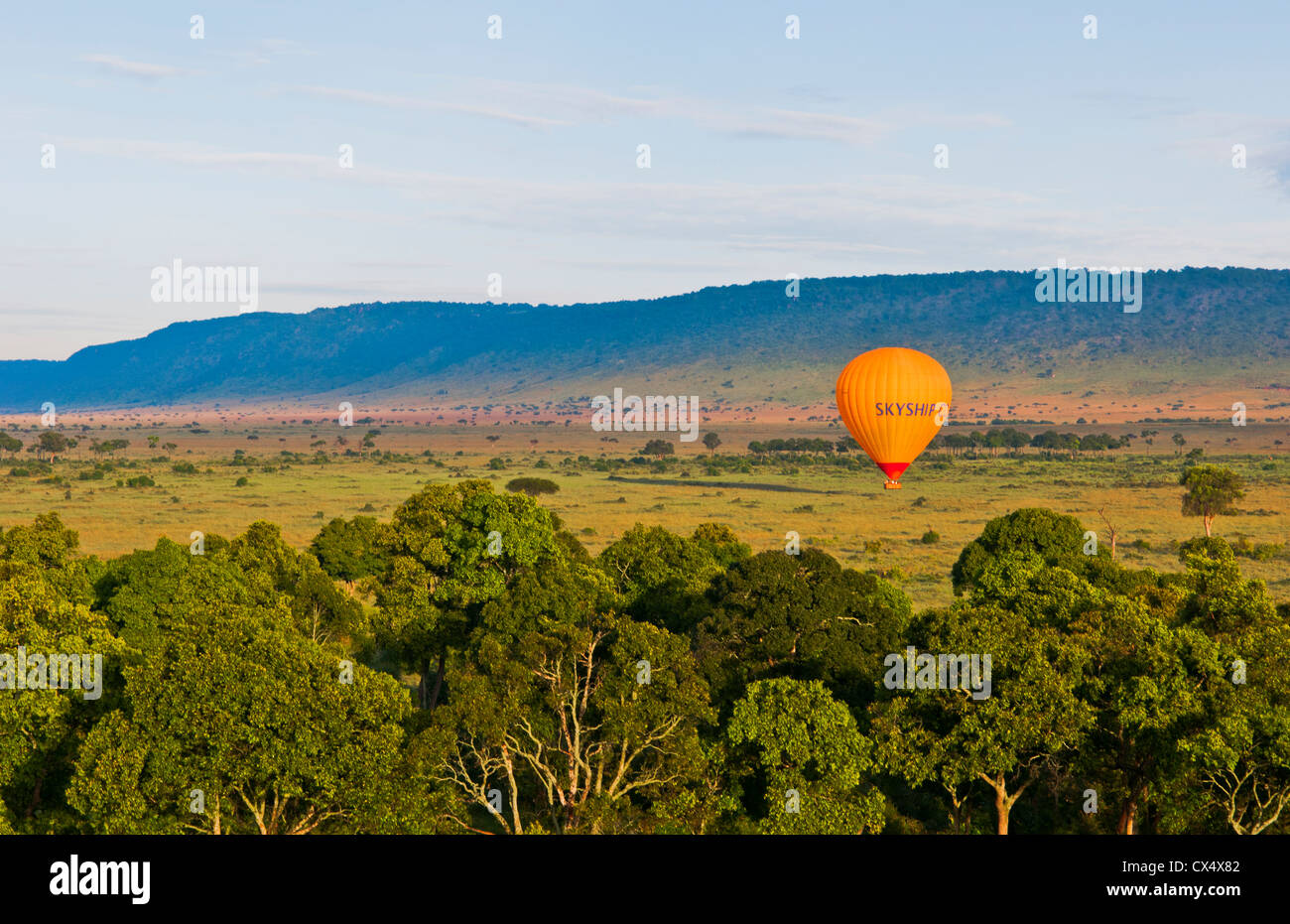 Kenya Masai Mara Africa hot air ballooning over the Masai Mara National Park at sunrise from above Stock Photo