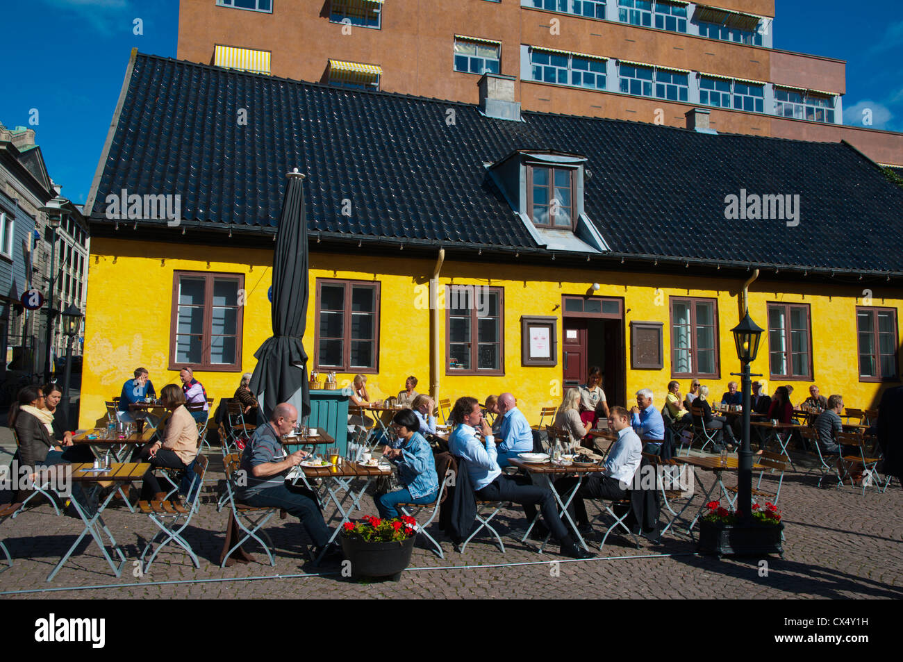 Restaurant terrace during lunch hour Christiania Torv square Kvadraturen district old town Oslo Norway Europe Stock Photo