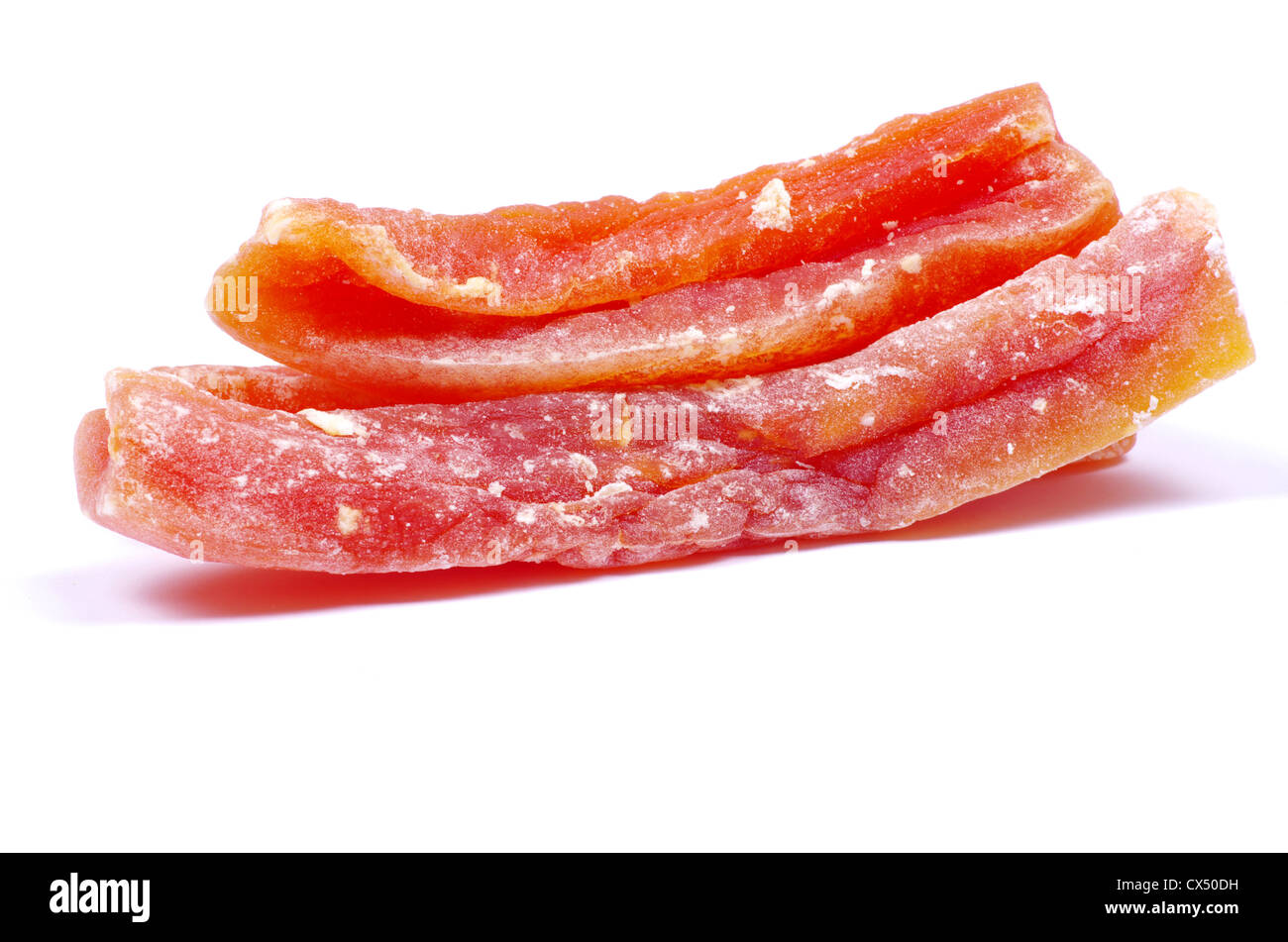 orange dried papaya slices over white background Stock Photo Alamy