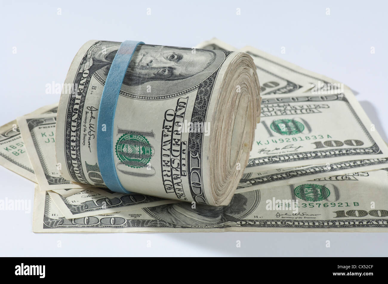 money roll of $100 bills Stock Photo