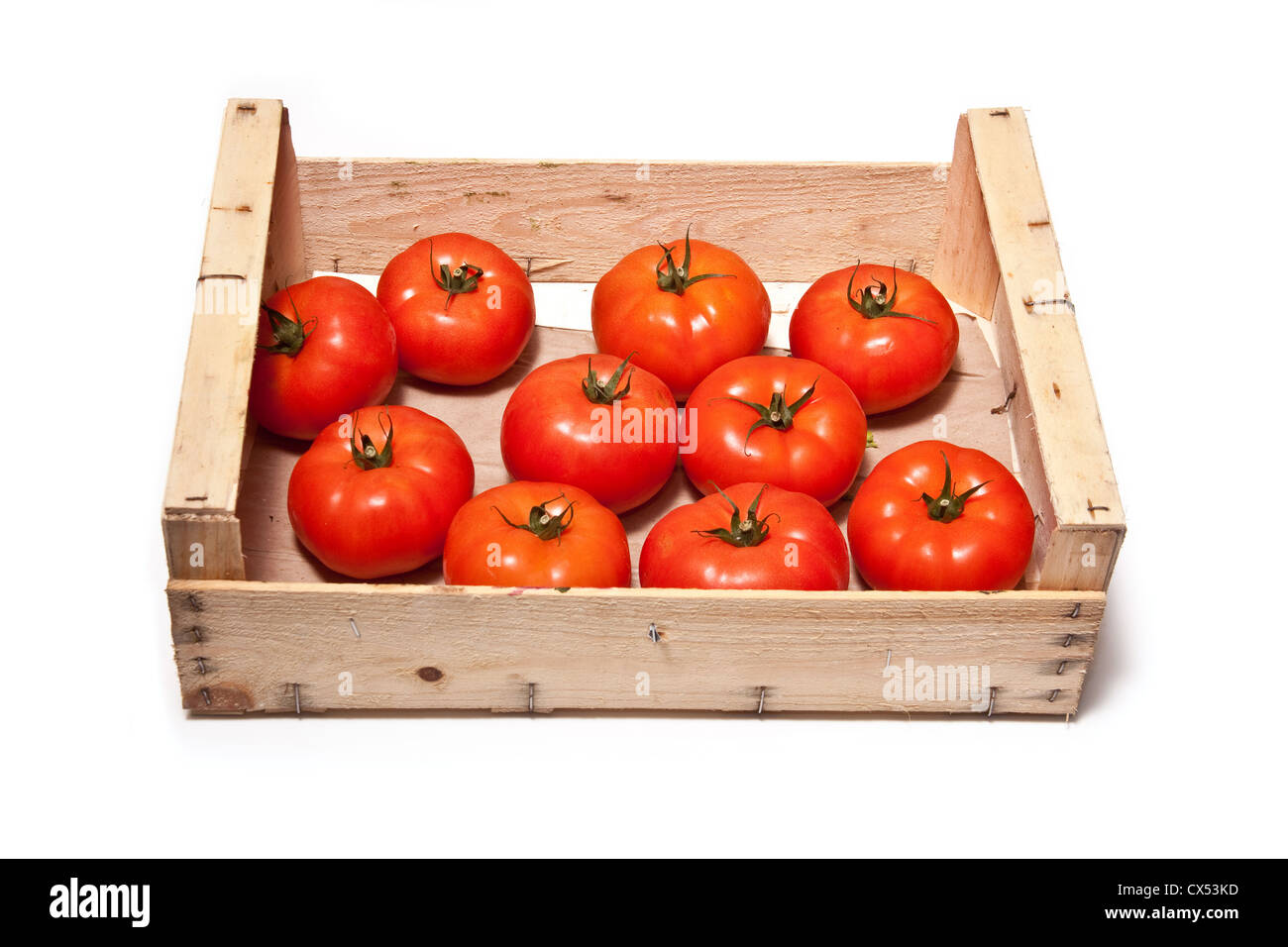 Box of beef tomato's isolated on a white studio background Stock Photo ...