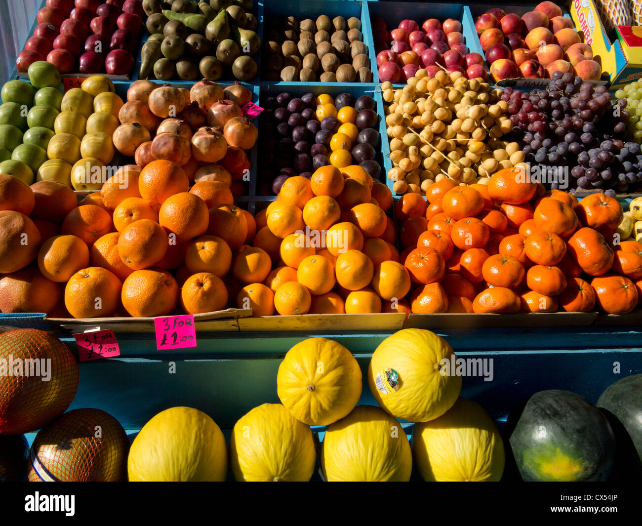 Tropical and British fruits on display in a shop in Kilburn, London, UK
